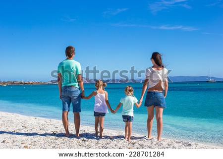 Family of four during summer beach vacation