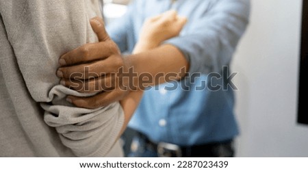 close up husband hand shake wife for trying to explaining about living and fight each other in home for relation conflict lifestyle concept Royalty-Free Stock Photo #2287023439