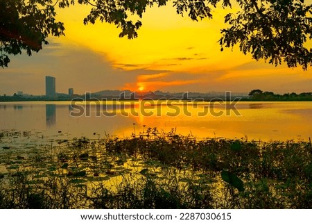 Beautiful view of Waduk Bunder or Water Dam Bunder in Gresik, East Java, Indonesia during sunrise and cloudy wheater. Royalty-Free Stock Photo #2287030615