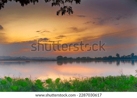 Beautiful view of Waduk Bunder or Water Dam Bunder in Gresik, East Java, Indonesia during sunrise and cloudy wheater. Royalty-Free Stock Photo #2287030617