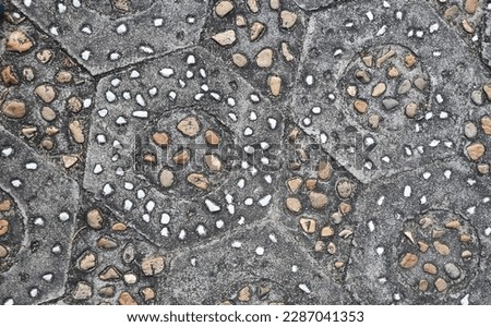 Stone pavement mosaic surface, close up.
