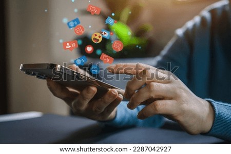 Concept of social media communication and digital online, people use smartphone playing with icon online social media, online marketing, technology, chat, post, like, follow at phone screen Royalty-Free Stock Photo #2287042927
