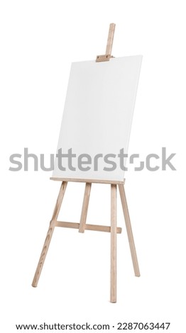 Wooden easel with canvas isolated on white. Artist's equipment Royalty-Free Stock Photo #2287063447