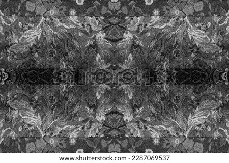 seamless. Brocade. Luscious black ink outlines intricate flowers and growing branches on this luxe noir-inspired brocade. On a glowing black background, there are many branches that look like vines.