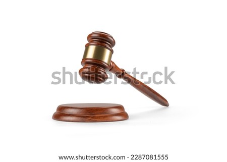 Judge's gavel hammer for adjudication isolated on white background. wooden auction hammer with a wooden stand. law and justice concept.  Royalty-Free Stock Photo #2287081555