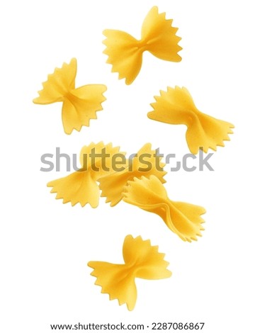 Falling raw Farfalle, uncooked Italian Pasta, isolated on white background, clipping path, full depth of field