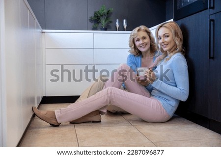 Family of two enjoying each other company over coffee