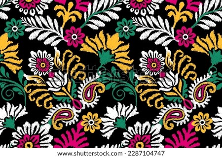 Ikat floral paisley embroidery on black background.Ikat ethnic oriental seamless pattern traditional.Aztec style abstract vector illustration.design for texture,fabric,clothing,wrapping,decoration. Royalty-Free Stock Photo #2287104747