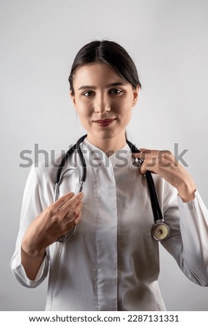 Portrait of a friendly  man with folded hands toothy smile have a good mood isolated on a single color background. the doctor smiles. portrait of a woman. Healthy Lifestyle