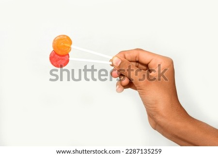 Hand hold lollipop icon flat isolated on white background.