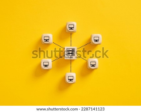 Client server connection or data center. Computer technologies. Wooden cubes with server and pc monitor icons linked with each other with lines.