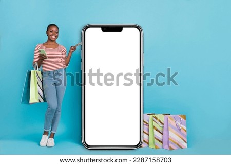 Full size photo of attractive lady hold telephone packages direct finger empty space panel isolated on blue color background