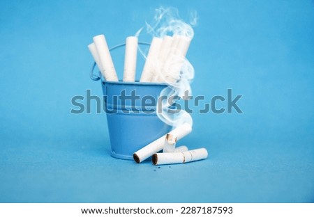 broken cigarette in trash can, no smoking banner, quit smoking - 31 may World No Tobacco Day info card