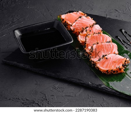 Salmon tataki in sesame with salad Royalty-Free Stock Photo #2287190383