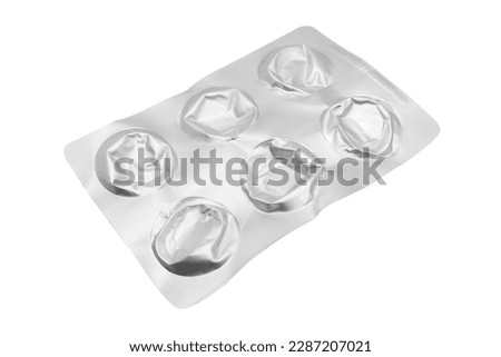 Empty pills of blister pack isolated on white background. Empty silver blister. Used blister pill. Empty blister pack from drugs. Royalty-Free Stock Photo #2287207021