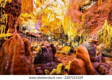 Beautiful Prometheus cave with no tourists and illuminated geological million years formations Royalty-Free Stock Photo #2287221429