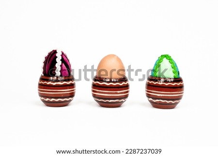 two artificial and one real egg
