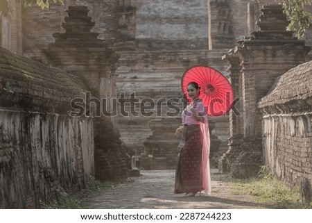 woman in traditional dress. person in Thai traditional . woman Thai traditional with umbrella