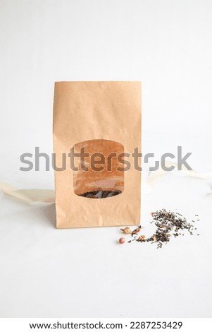 Craft bags for packaging tea, coffee, sweets. Top view. Place for text and logo. Nateral background. The concept of packaging, food. High quality photo