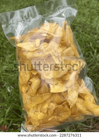 Picture of banana chips packed inside a plastic container
