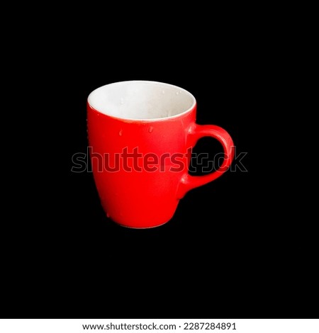 Red mug. Red cup for tea or coffee on background.