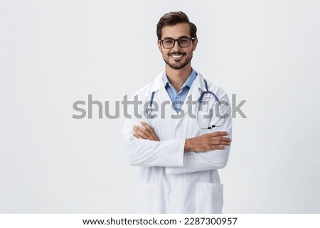 Man doctor in white coat and eyeglasses smile shows hand gestures signs on white isolated background looks into camera, copy space, space for text, health Royalty-Free Stock Photo #2287300957
