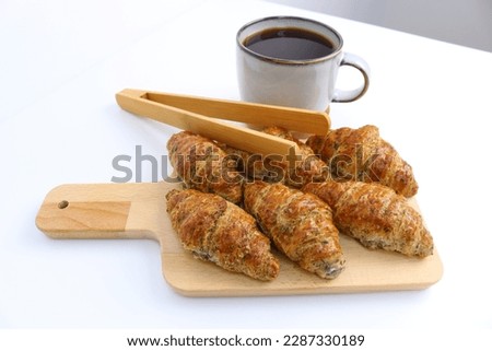 fresh bakery croissant recipe snakes in wooden background 