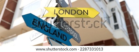 Tourist signs of cities and countries with directions. Travel tourism and trips to different cities concept