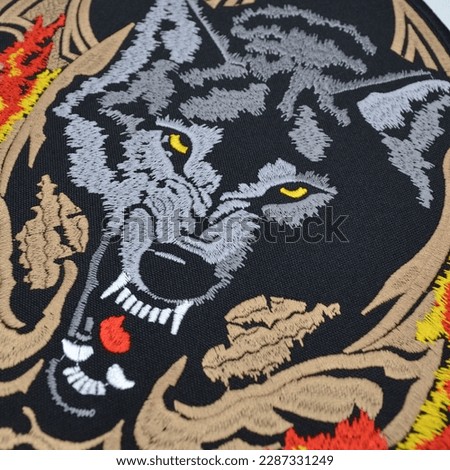 Embroidered patch with the image of a wolf and a grin. Accessory for metalheads, punks, rockers, bikers, satanists, emo, street aggressive subcultures.
