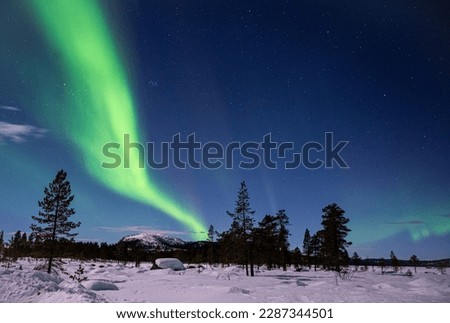 Northern Lights over Swedish Lapland Royalty-Free Stock Photo #2287344501