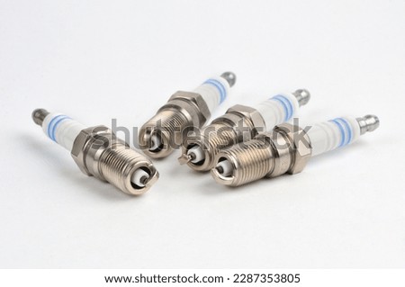 Spark plug for cars with a gasoline engine on an isolated white background

