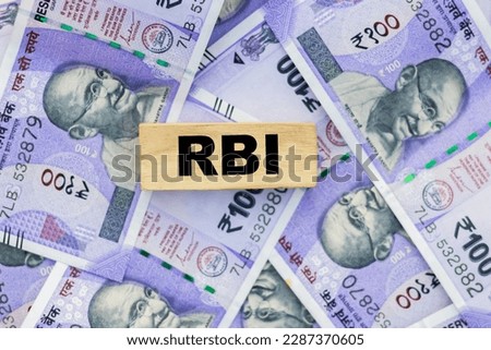 RBI bank word with Indian bank notes currency Royalty-Free Stock Photo #2287370605