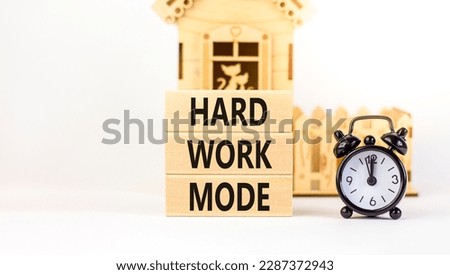 Hard work mode symbol. Concept words Hard work mode on wooden block on a beautiful white table white background. Black alarm clock. Business and Hard work mode concept. Copy space.