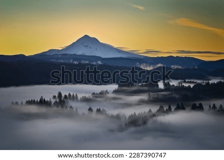 Beautiful image of Mount Hood over foggy forest at Jonsrud Viewpoint during sunrise Royalty-Free Stock Photo #2287390747