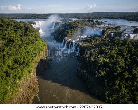 Beautiful view to Iguazu Falls waterfalls with green rainforest in the border of Brazil and Argentina Royalty-Free Stock Photo #2287402337