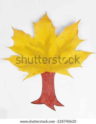 Autumn leaves with painted tree isolated on white