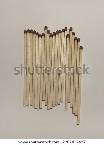 Picture of match sticks lined up, white background