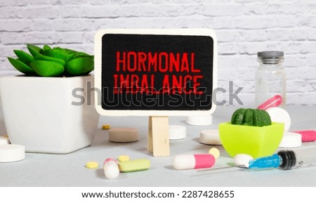 Hormone growth hormone written on notebook. Test tubes and hormones list Royalty-Free Stock Photo #2287428655