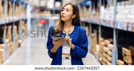 Portrait engineer asian woman shipping order detail on tablet check goods and supplies on shelves with goods background inventory in factory warehouse.logistic industry and business import export