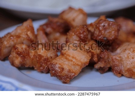 fried streaky pork with fishsauce Royalty-Free Stock Photo #2287475967