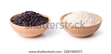 Black rice and white rice in wooden bowl isolated on white background.  Royalty-Free Stock Photo #2287480557