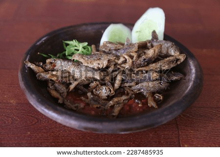 Sambel wader is a typical culinary from the city of Mojokerto which is made from wader fish which has been coated with spices and deep fried Royalty-Free Stock Photo #2287485935