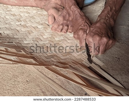bamboo slats being woven manually
