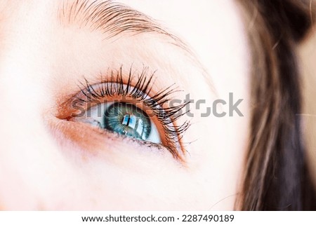 Beautiful gray-blue eyes with long lashes. Young woman, a girl is looking up. Dreaming, praying, turning to God concept. Visual gymnastics for improving vision. Female look on a sky with a hope. Royalty-Free Stock Photo #2287490189