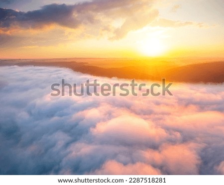 Awesome bird's-eye view of the valley covered with thick fog. Location place Dniester canyon national park, Ukraine, Europe. Aerial photography, top view drone shot. Discover the beauty of earth.
