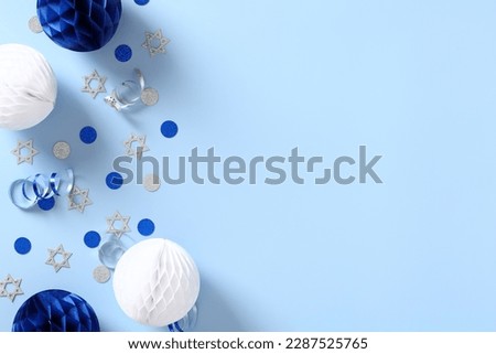 Banner design for Israel public holidays. Festival decorations on blue table top view. Royalty-Free Stock Photo #2287525765