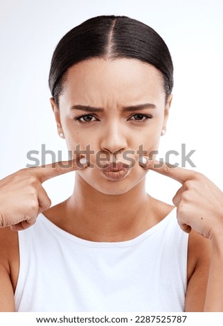 Frown, portrait and woman in studio sad, disappointed and unhappy against white background. Frown, upset and hands on face of girl with negative emotion, confused or doubt while posing isolated Royalty-Free Stock Photo #2287525787