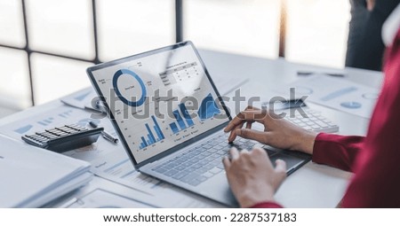 Close up Businesswoman using calculator and laptop for calculating finance, tax, accounting, statistics and analytic research concept