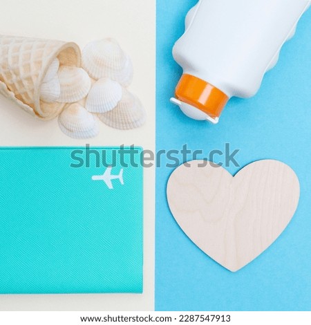 Square photo with sunblock, empty wooden heart, ice cream cone with seashells and passport cover with airplane picture. The theme of summer holidays on the beach and the sea. Flat lay. Top view.