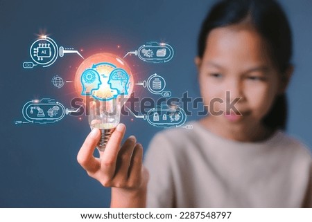 Girl holding light bulb with virtual artificial intelligence machine learning thinking idea chatbot conversation assistant.Futuristic technology transformation. Automation business technology concept.